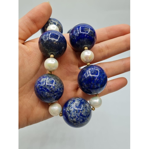 508 - Large lapis lazuli and pearl necklace designed and owned by 'Cher'. Weight 3.8g and length 25cms