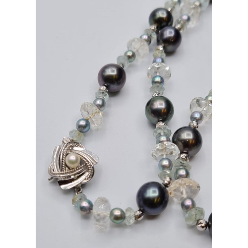 520 - Aquamarine & Celtic pearl necklace with 14ct gold clasp, weight 31.8g & 44cm