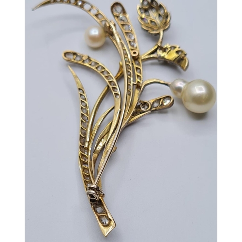 522 - Platinum and diamond flower brooch with pearl blooms, weight 11.12g & 7cms long