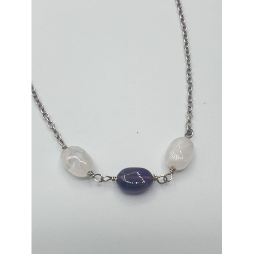 550 - Stone set silver chain consisting of a dainty silver chain having two moonstones and a central ameth... 