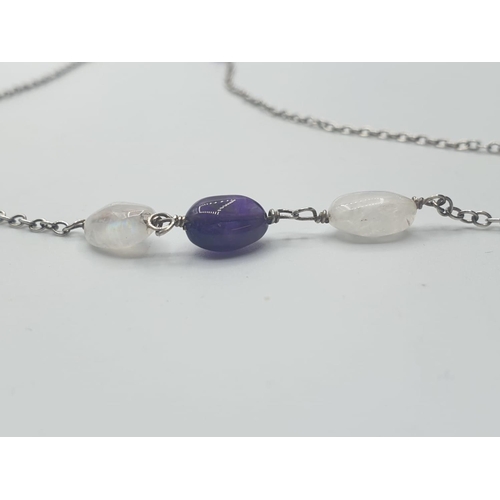 550 - Stone set silver chain consisting of a dainty silver chain having two moonstones and a central ameth... 