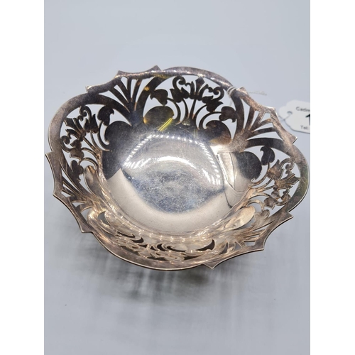 564 - Mappin & Webb silver footed bowl with pierced floral design. Diameter 128mm & 136g