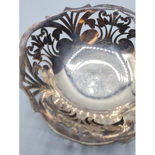 564 - Mappin & Webb silver footed bowl with pierced floral design. Diameter 128mm & 136g