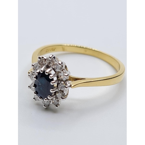 22 - 18ct diamond and sapphire cluster ring, weight 2.8g and 0.20ct diamond approx, size N