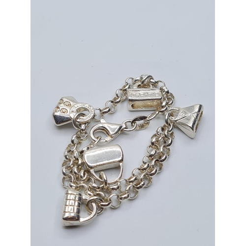 94 - sterling silver charm bracelet, weight 13.5g