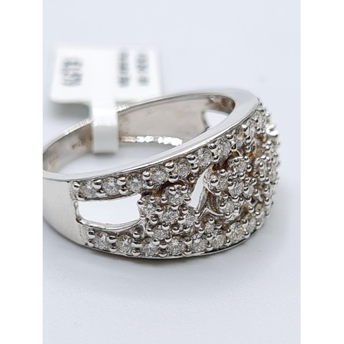 95 - 18ct white gold diamond set fancy band ring, weight 5.7g and 0.85ct diamonds approx, size N