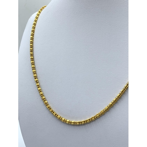 146 - 21ct yellow gold necklace Eastern style, 25.8g weight and 50cm long approx