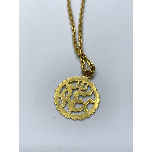 443 - 22ct gold chain with Eastern pendant, weight 41g & length 65cms