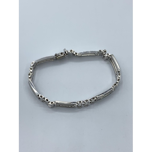 65 - 18ct white gold bracelet with inset diamond, 32.9g weight and 27cm