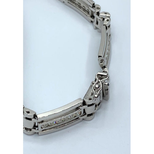 65 - 18ct white gold bracelet with inset diamond, 32.9g weight and 27cm