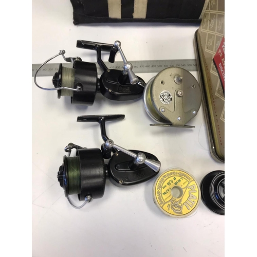 570 - Fold up Fisherman's stool, catch hook and various accessories and reels