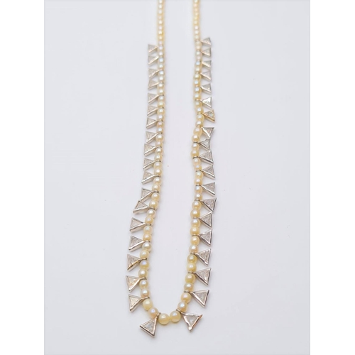 574 - String of small delicate pearls decorated with 38 triangular diamonds set in 14ct gold 11.4g, 28cms ... 