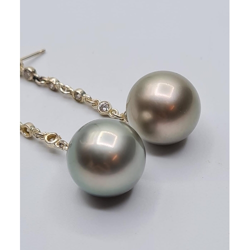 577 - 18ct white gold drop pearl earrings with 6 small diamonds on drop chain, weight 10g