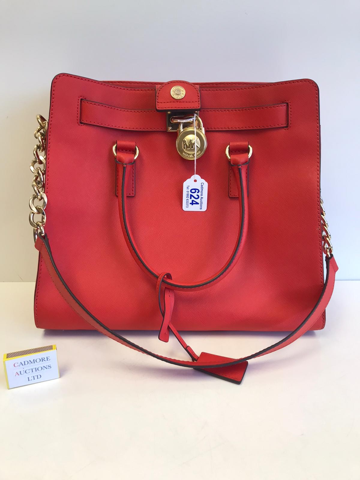 A Red Michael Kors Handbag serial number 6736968 37 cm wide x height 33 cm  As new condition