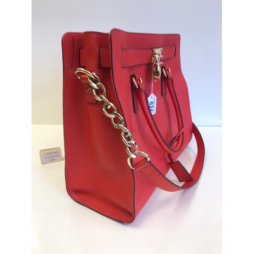 A Red Michael Kors Handbag serial number 6736968 37 cm wide x height 33 cm  As new condition