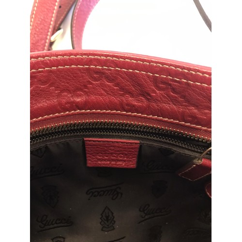 270 - Gucci handbag in red embossed leather.
245 mm wide 210 mm height. Very slight wear to colour at lowe... 