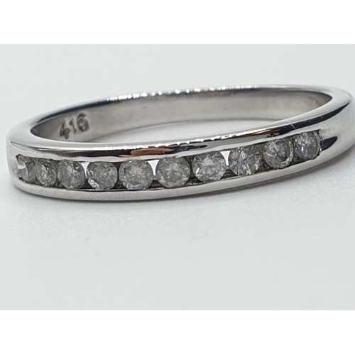 162 - 9ct white gold diamond channel set 1/2 eternity ring 0.20ct weight 2.1g and size N