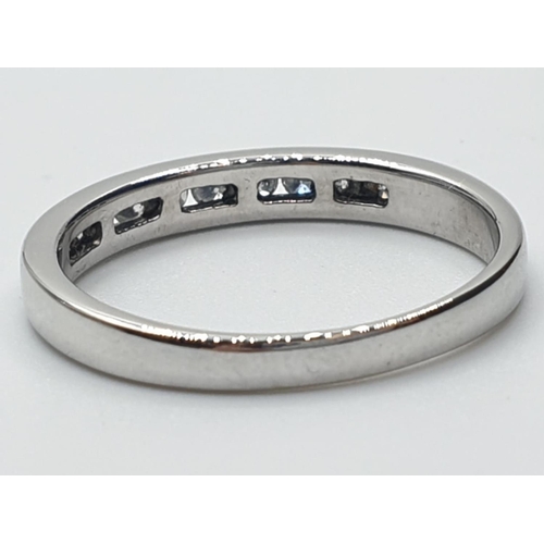 162 - 9ct white gold diamond channel set 1/2 eternity ring 0.20ct weight 2.1g and size N