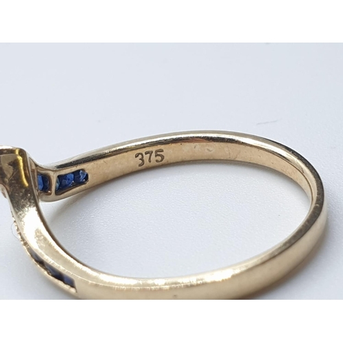 175 - 9ct yellow gold diamond and sapphire wishbone ring size M weight 1.5g