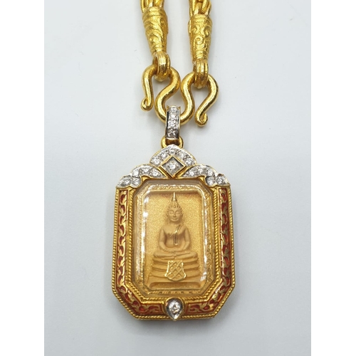 25 - 21ct Buddhist pendant on 21ct necklace, weight 101.7g and 56cm long approx