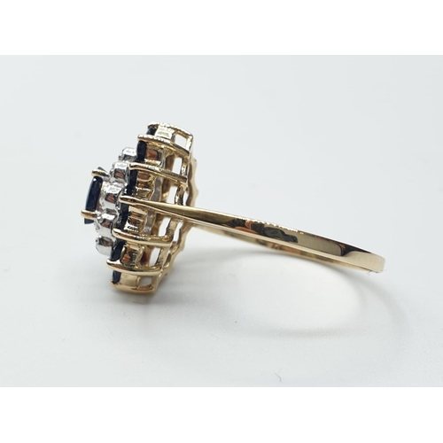 290 - 9ct yellow gold diamond and sapphire cluster ring, weight 2.2g and size M1/2