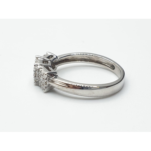 293 - 18ct white gold diamond set triple cluster ring with 0.25ct diamonds, weight 1.78g and size G1/2 app... 