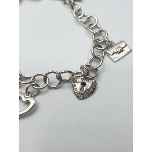 315 - sterling silver charm bracelet with heart key and T-bar 17.3g