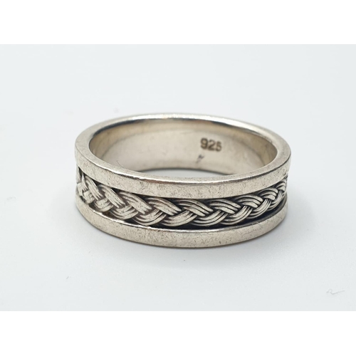 361 - sterling silver Celtic design band ring, 7.5g and size V