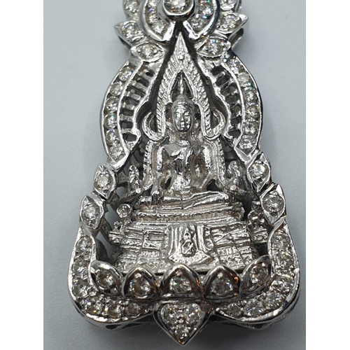 83 - 18ct white gold and diamond Buddha pendant. weight 18.1g and 4cm drop