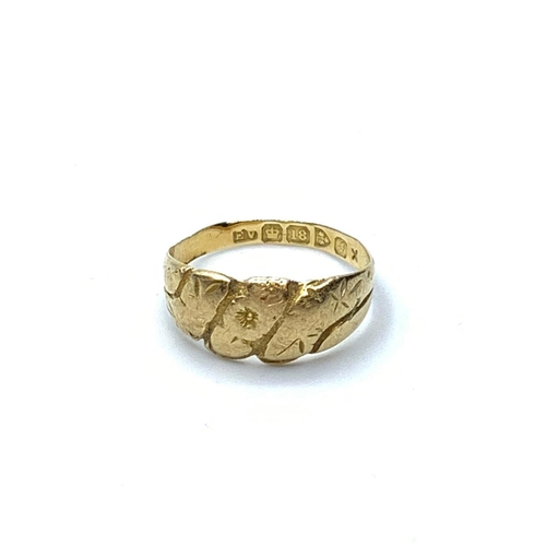 614 - 18ct gold antique ring. Hallmark for Edward Vaughton Chester 1909. Floral work to top. Rubbed ageing... 