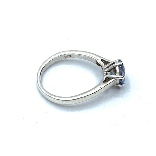 626 - Silver ring having sparkling faceted blue topaz coloured solitaire in a six claw mount. Marked 925 s... 