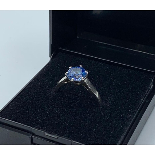 626 - Silver ring having sparkling faceted blue topaz coloured solitaire in a six claw mount. Marked 925 s... 