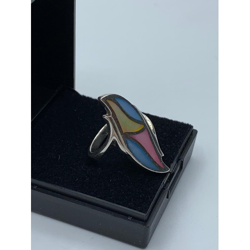 638 - Silver ring unusual shape having four enamel coloured panels to top mount. Marked 925 silver, size L... 