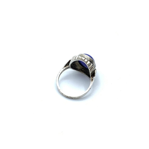 645 - Stone set silver ring having royal blue oval cabochon to mount set in a surround of silver marcasite... 