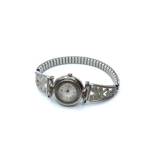 649 - Ladies cocktail wristwatch. Having stainless steel expendable strap with beaded hearts and scrolls. ... 