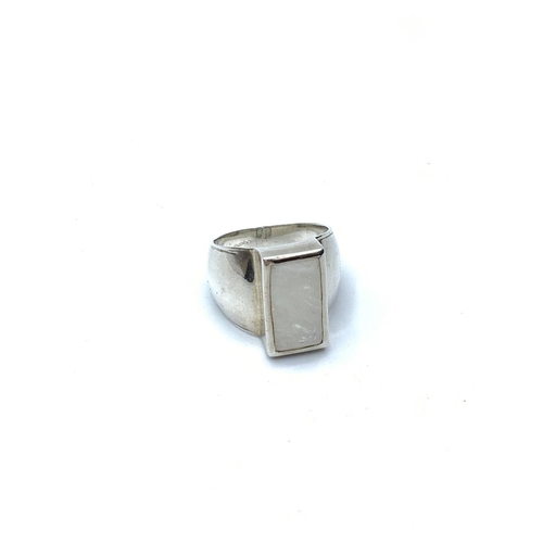 650 - Silver ring having rectangular mother of pearl mounted to top. Wide shouldered. Smooth silver band. ... 