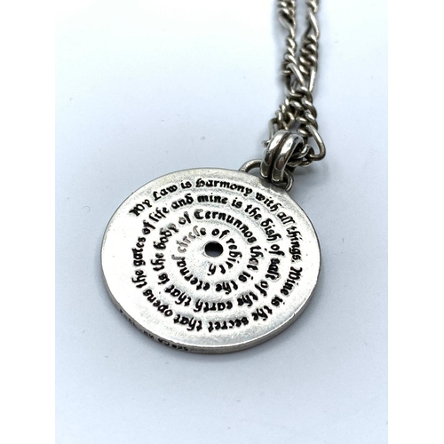 655 - Silver pendant and chain pendant in circular disc form having a Doreen Valientes poem to both sides.... 