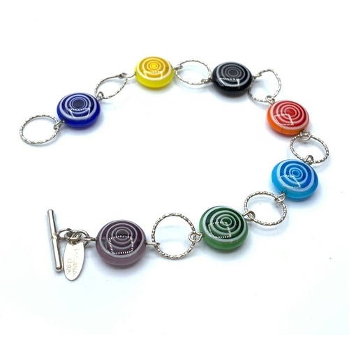 657 - Silver multi stone bracelet having circular coloured glass stones linked by silver hoops. Delicate a... 