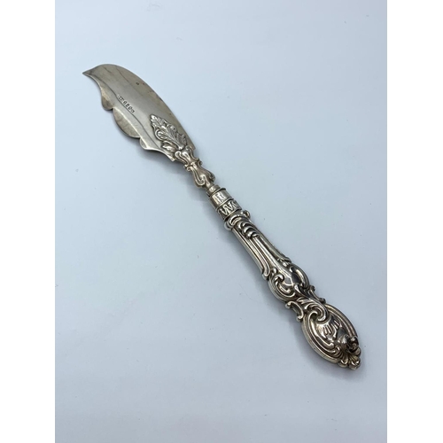 661 - Antique silver large butter knife. Early Victorian. Having engraved scroll design to blade and scrol... 