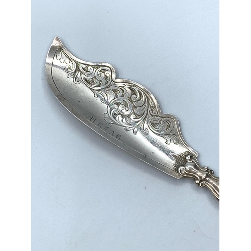 661 - Antique silver large butter knife. Early Victorian. Having engraved scroll design to blade and scrol... 