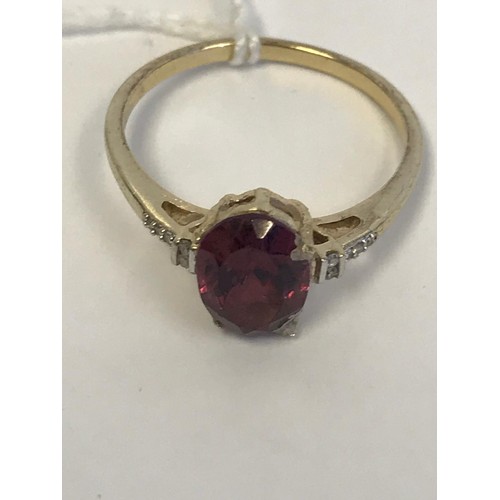 604 - 10k Garnet Ring with clear stone shoulders