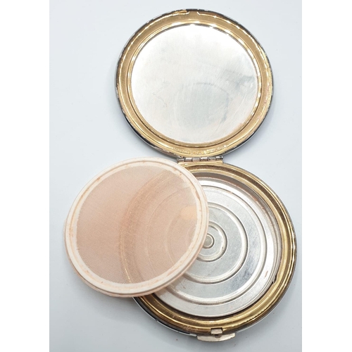 539 - Pair of 1950s/60s compacts. Both having mirrored lids. Gold colour by mascot. Silver colour by Kigu