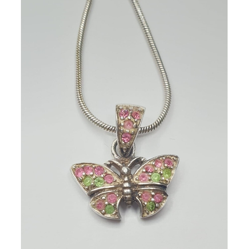 545 - Silver butterfly pendant on a silver chain. Gift boxed. Delicate butterfly having pink and green spa... 