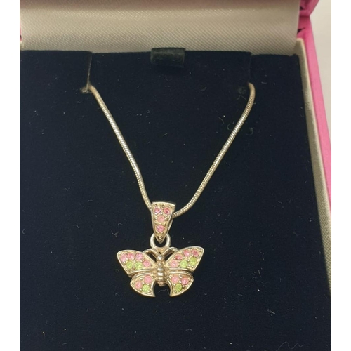 545 - Silver butterfly pendant on a silver chain. Gift boxed. Delicate butterfly having pink and green spa... 