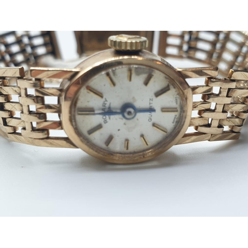 664 - A vintage ladies Rotary 9ct gold wristwatch with gold gate bracelet strap and security chain. 16.4g ... 