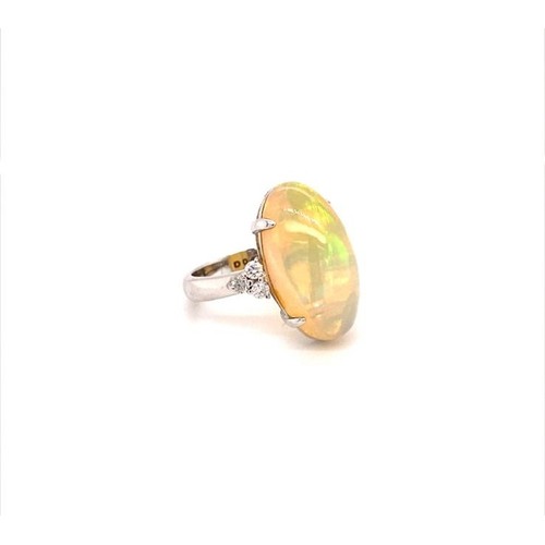 802 - 18K OPAL RING (Oval Ethiopian cabochon 8ct opal) and diamonds, weight 6.04g and size M1/2 (DCR73)