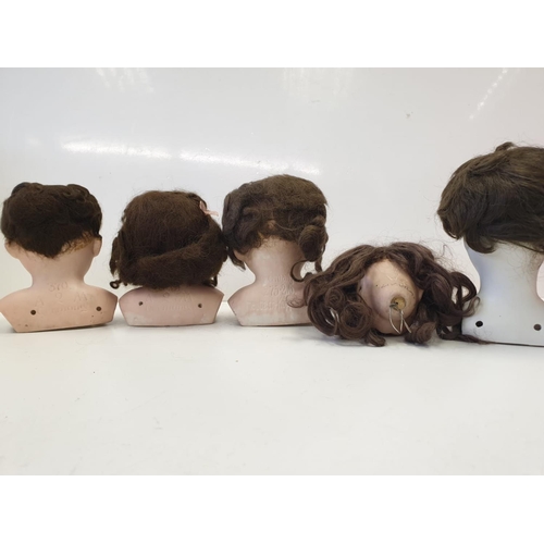 29 - Five Bisque Porcelain Dolls Heads 4 of which have Embossed German Marks.