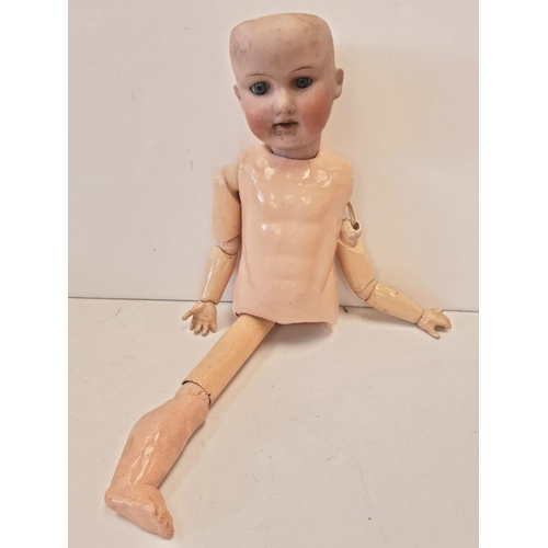 35 - A Collection of Antique Jointed Dolls.