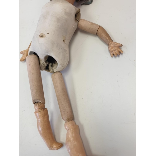 35 - A Collection of Antique Jointed Dolls.