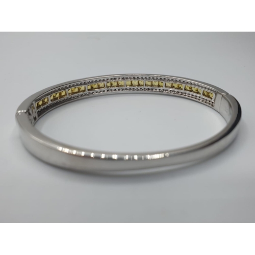 28 - 18ct White Gold Hinged Bangle with Channel Set Diamond ( 0.90ct) and Yellow Sapphire Designed by Ali... 